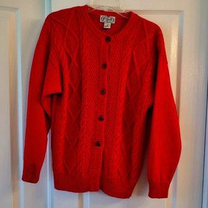 red cable knit sweater, with brown buttons